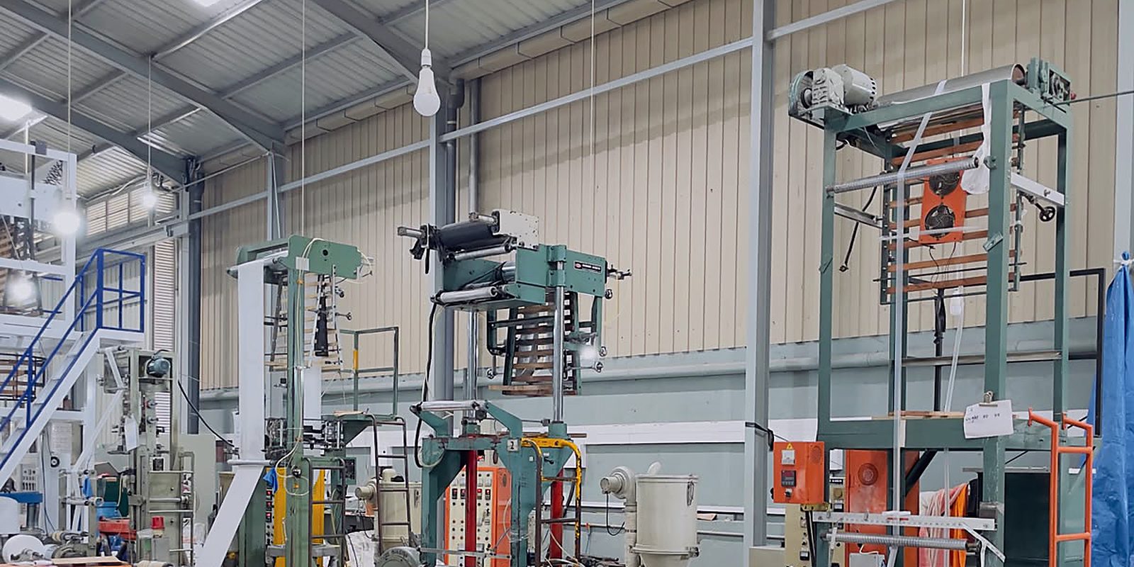 A worker at the winder as finished film comes off the line
