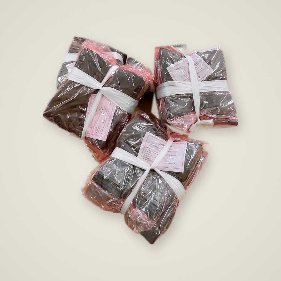 Black polythene garbage bags, bundled and labelled for despatch