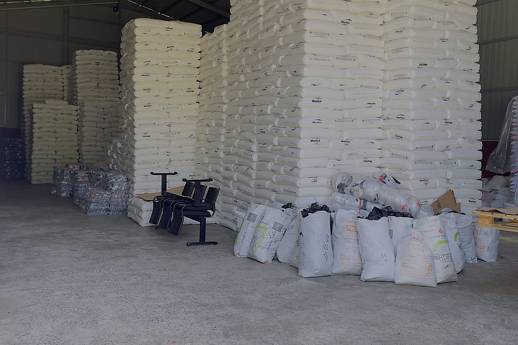 Sacks of polythene resin stacked to the roof of the store